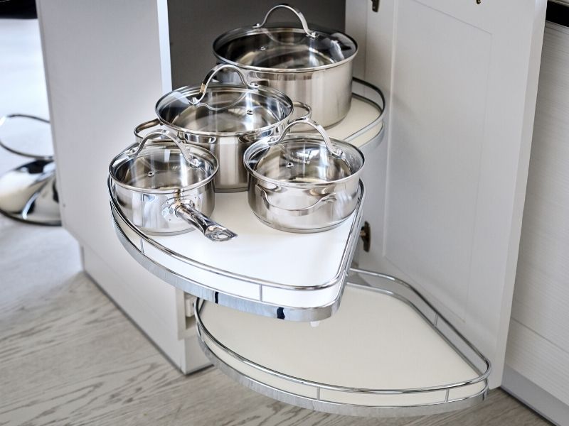 pots and pans in a cabinet