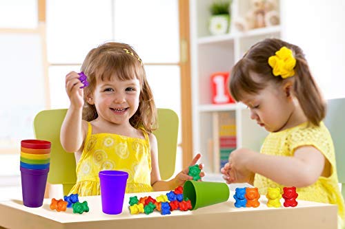 A little girl sitting at a table