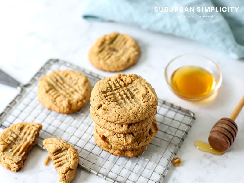 Flourless peanut butter cookies stacked on a cooling rack.