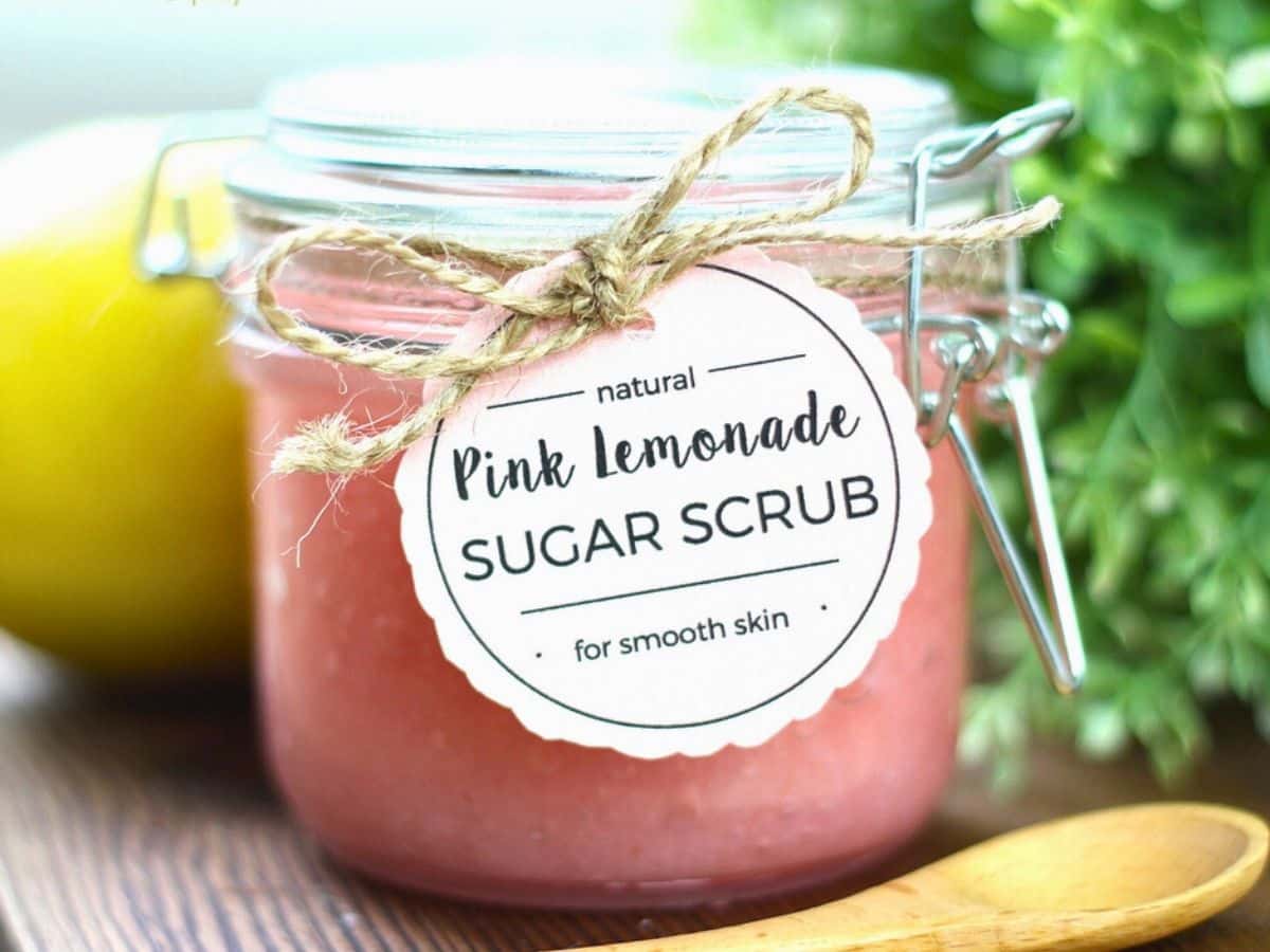 A jar of sugar scrub with a printable label attached.