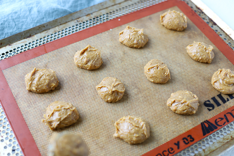 Flourless peanut butter cookie batter on a baking sheet.