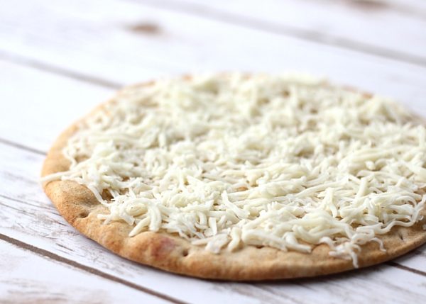 Whole wheat flatbread topped with mozzarella cheese.