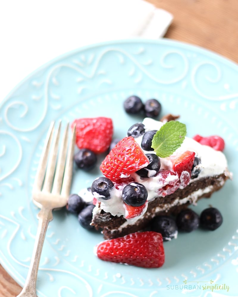 Looking for a yummy brownie recipe? Layers of fudgy chocolate brownie with a creamy center, topped with berries make this Brownie Strawberry Shortcake a winning dessert combination!