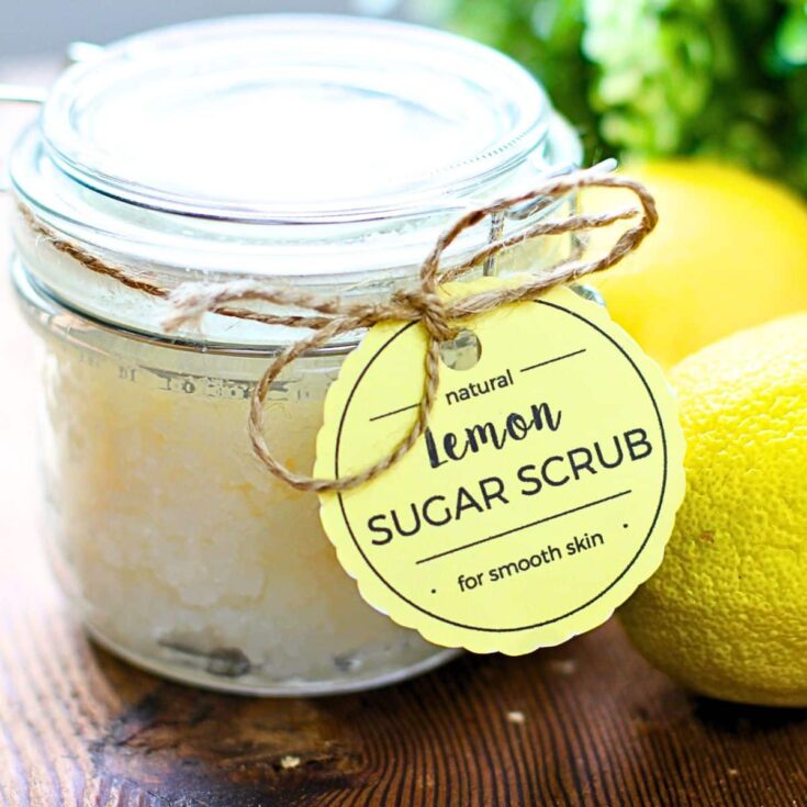 A jar of lemon body scrub with a label attached with twine.