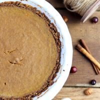 This Paleo Pumpkin Pie tastes delicious and is grain and dairy free.  This healthier Thanksgiving recipe has just the right amount of spice and a velvety filling you'll crave all season long!  #paleothanksgivingrecipe