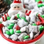 Reindeer chow with M&Ms in a santa bowl.