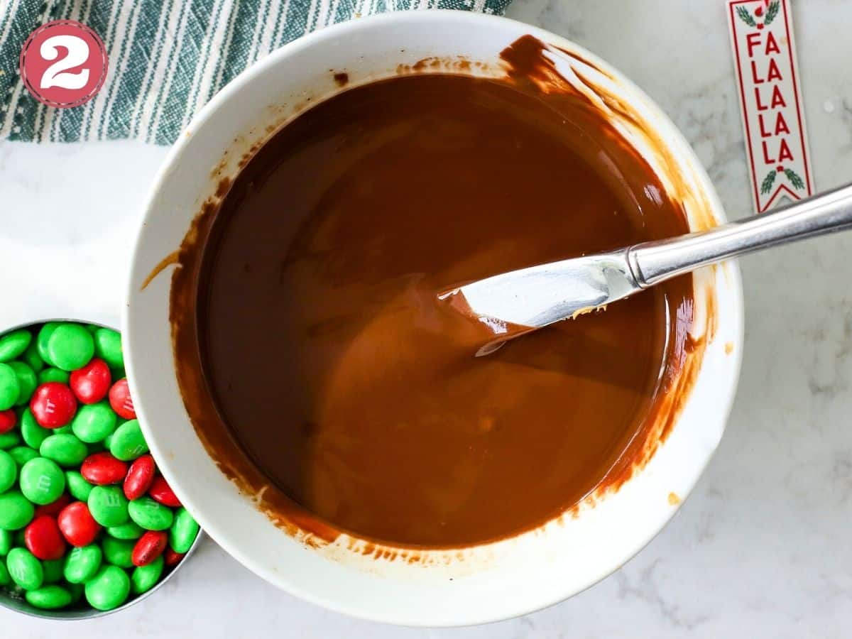 Melted chocolate and peanut butter for a Reindeer Chow recipe.