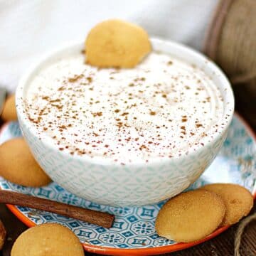 Holiday dip in a bowl with vanilla wafer cookies on the side.