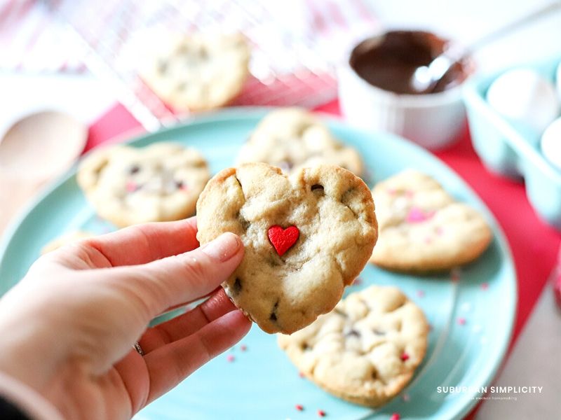 Hand holding Valentine's Day cookies 