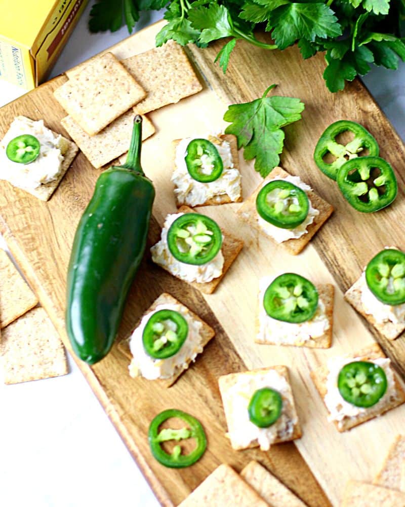 Wheat Thin crackers topped with cheese and jalapenos.