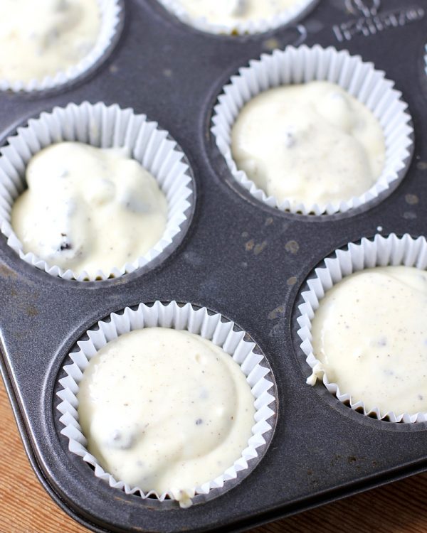 Muffin tin filled with Oreo Cheesecake batter. 