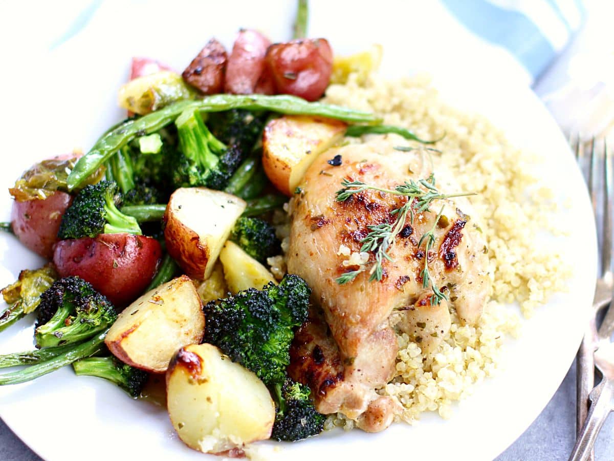 Plate with baked honey garlic chicken and vegetables.