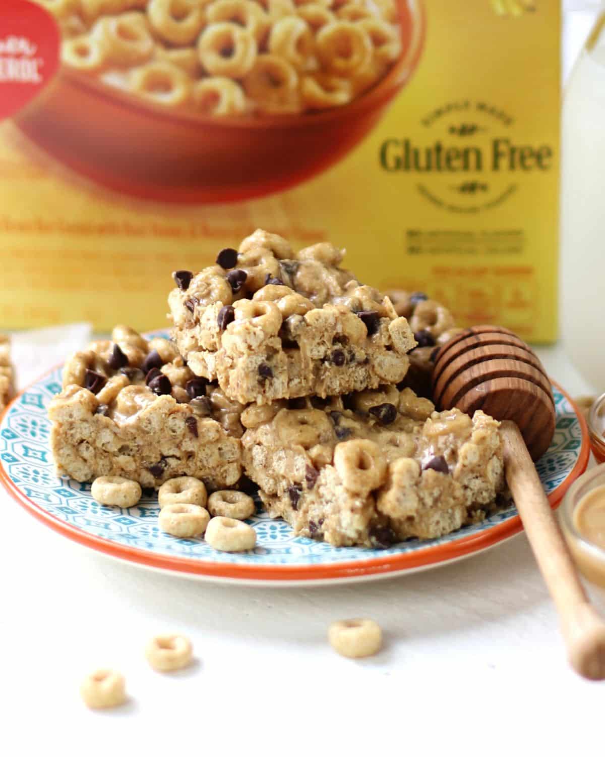 Peanut Butter Cheerio Bars with chocolate chips on a plate.