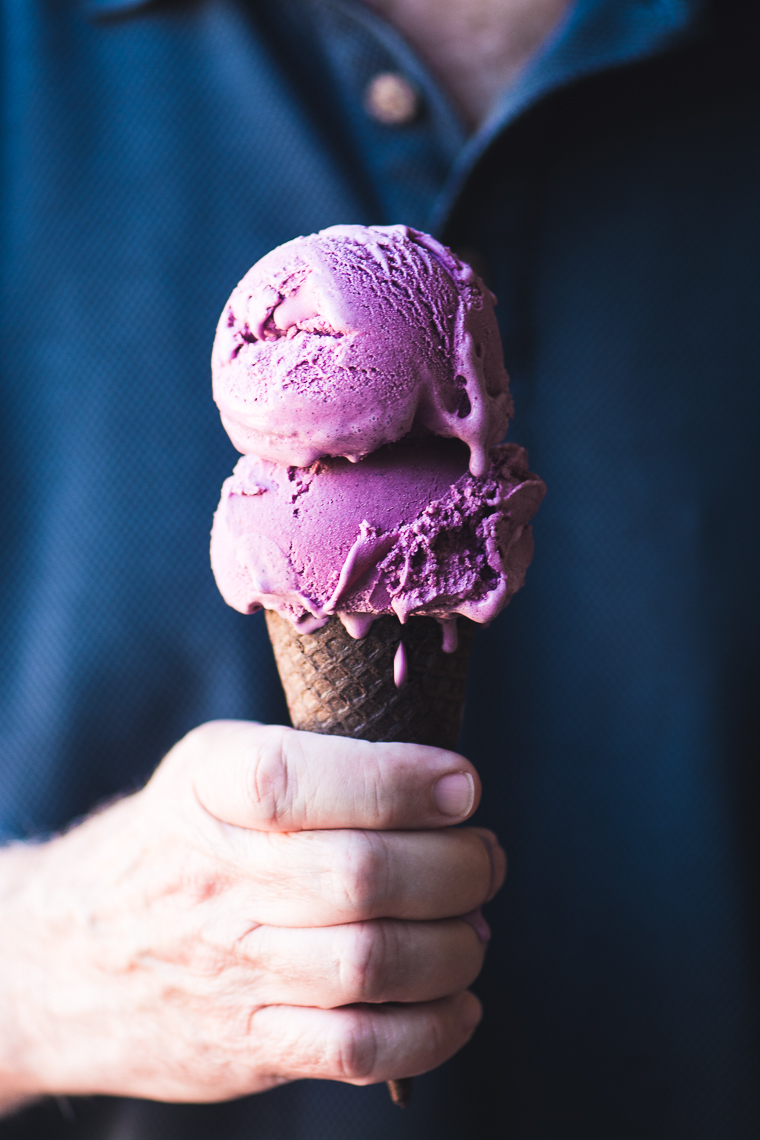 Two scoops of ice cream on a cone