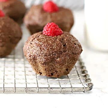 flaxseed muffin with a raspberry on top.