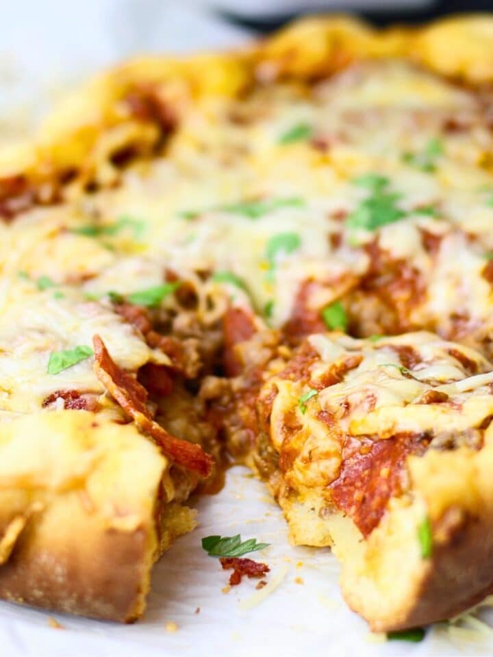 A deep dish pizza cooked in the slow cooker.