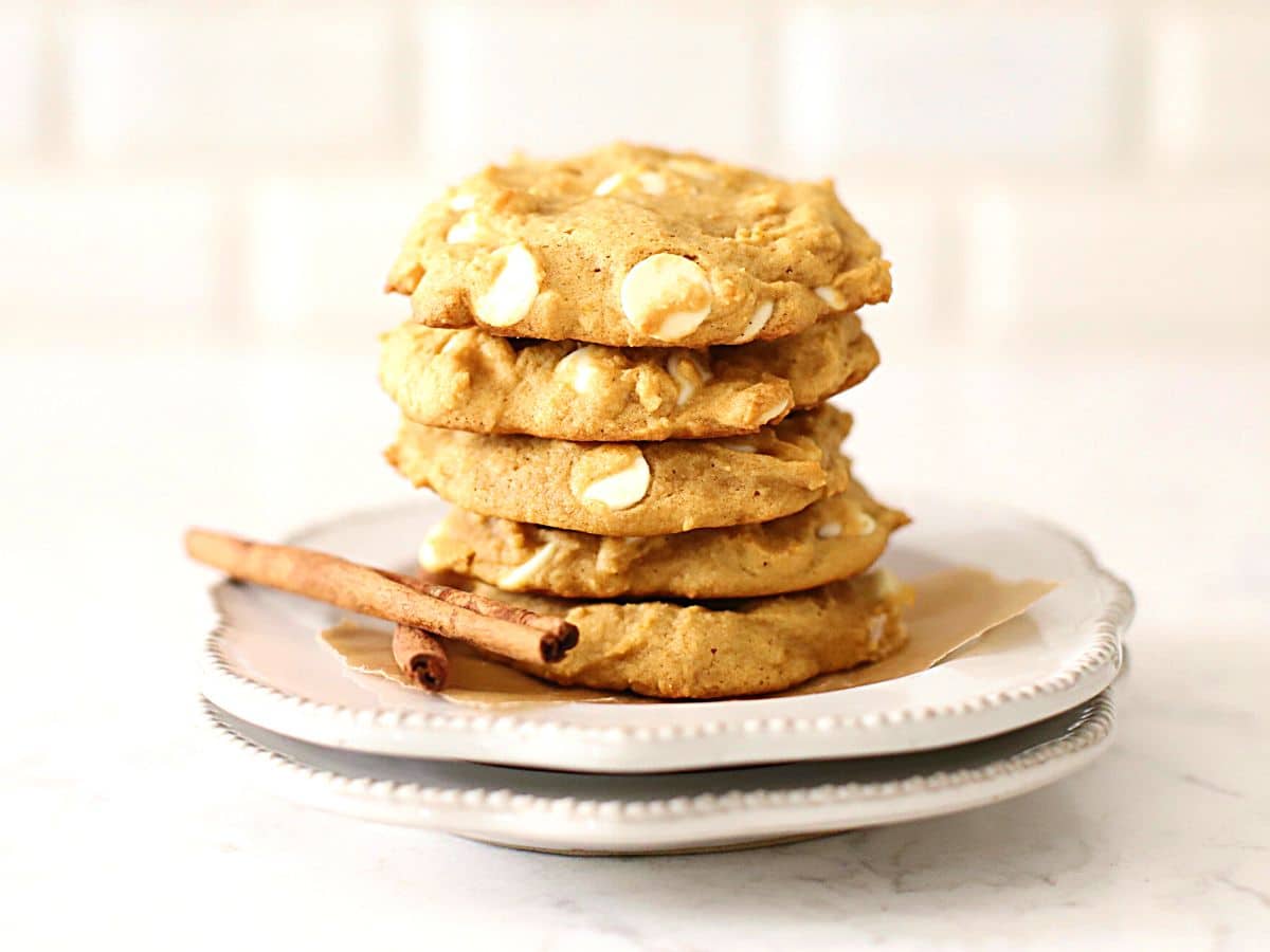 Pumpkin spice cookies stacked on a plate.