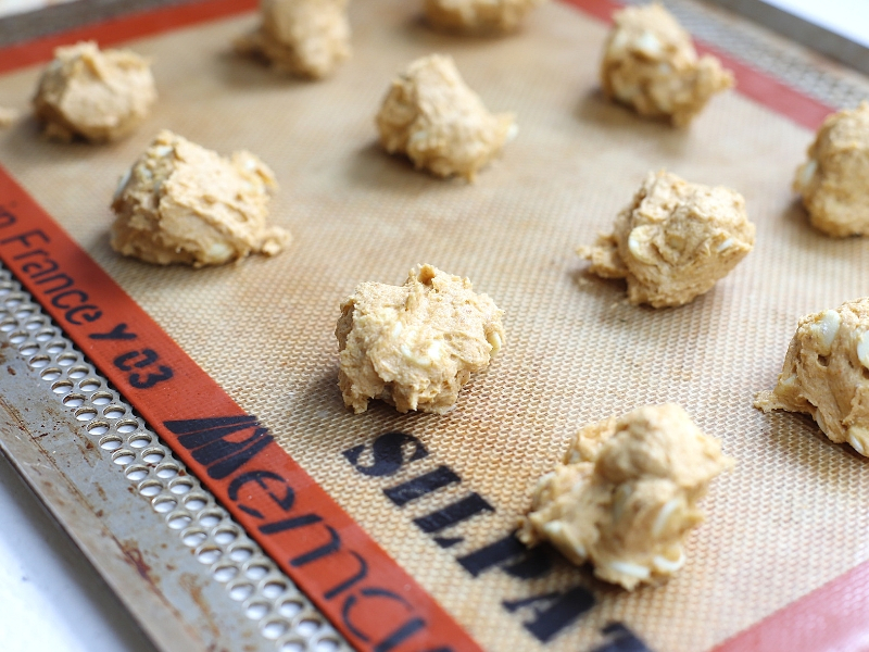 Pumpkin spice cookies on a baking sheet.