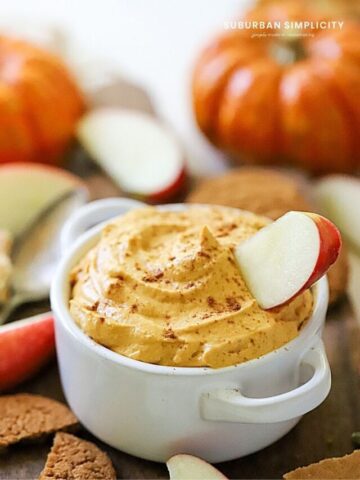 Recipe for pumpkin dip in a bowl with an apple