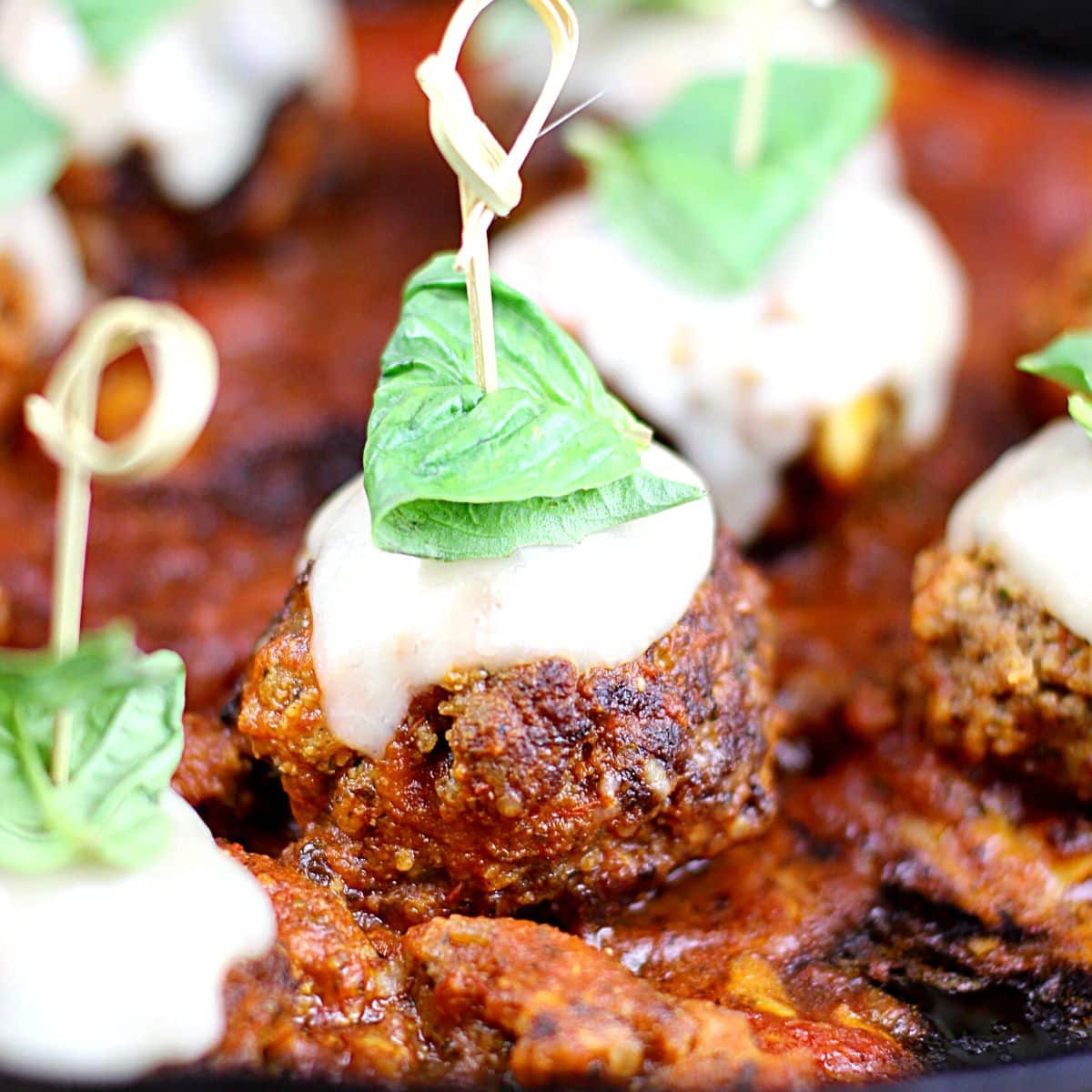 Italian meatball with a toothpick stuck in it.