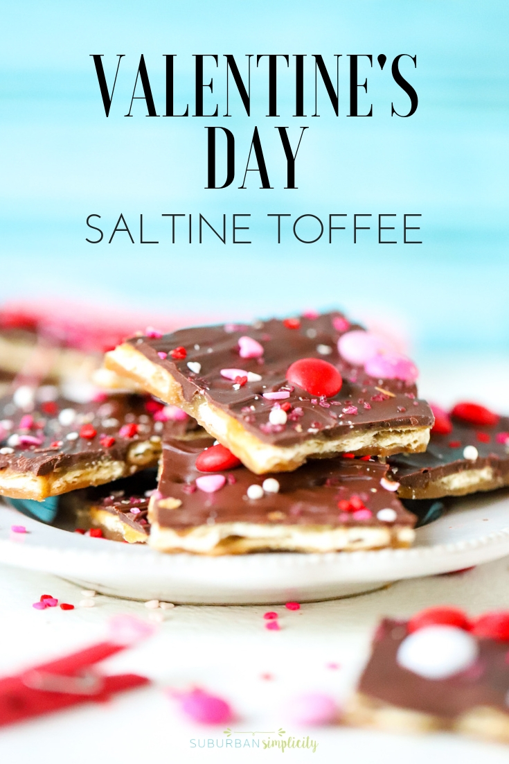 You can't resist and salty + sweet goodness of Valentine's Day Saltine Toffee! This easy and addictive candy recipe is the perfect way to celebrate Valentine's Day! #suburbansimplicity #toffee #saltinetoffee #valentinesday