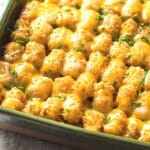 Freshly baked tater tot casserole in a casserole dish.