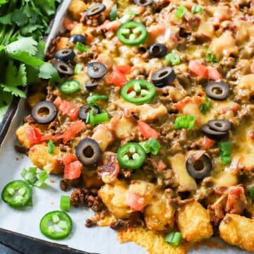 Baked tater tot appetizer on a sheet pan.