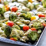 A healthy chicken pesto recipe on a baking pan