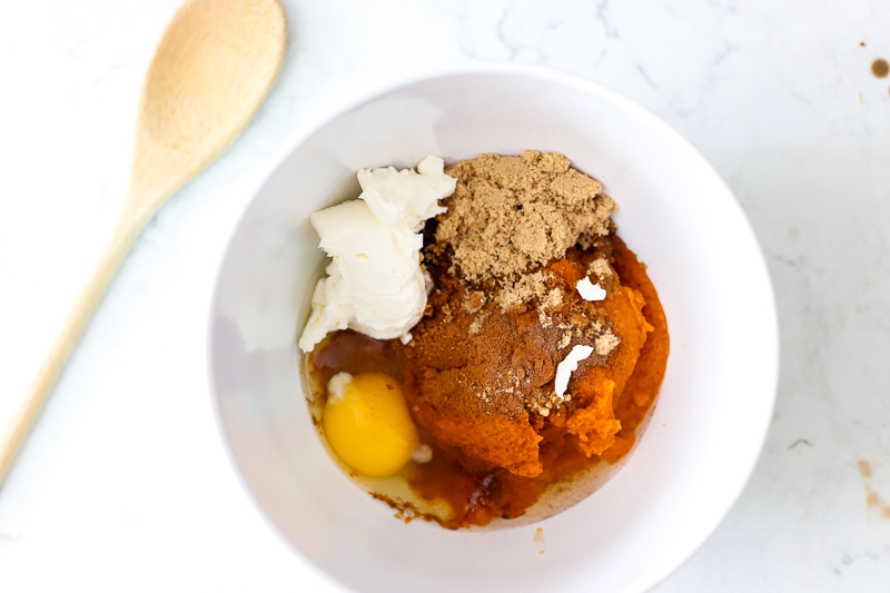 Ingredients in a bowl for pumpkin pie bombs