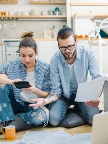 Couple creating a simple family budget together.