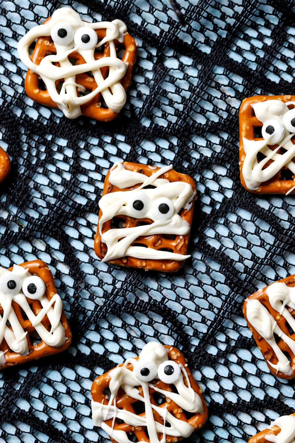 Mummy pretzels with candy eyes.