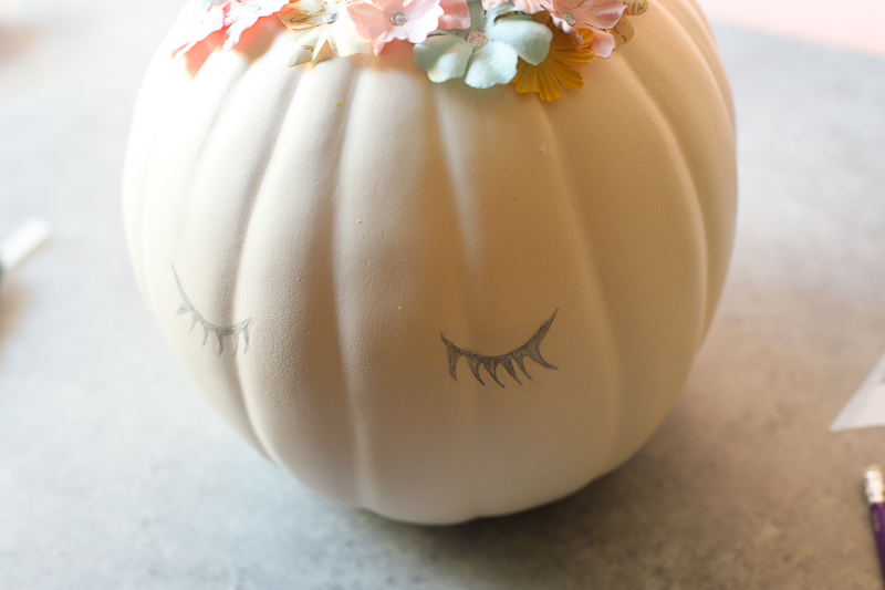 pencil drawn eyelashes on pumpkin 