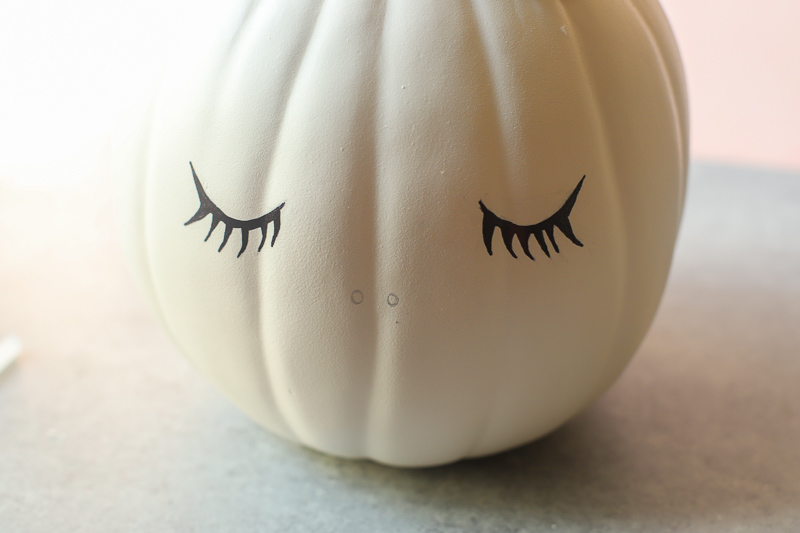 sharpie drawn Eyelashes on pumpkin