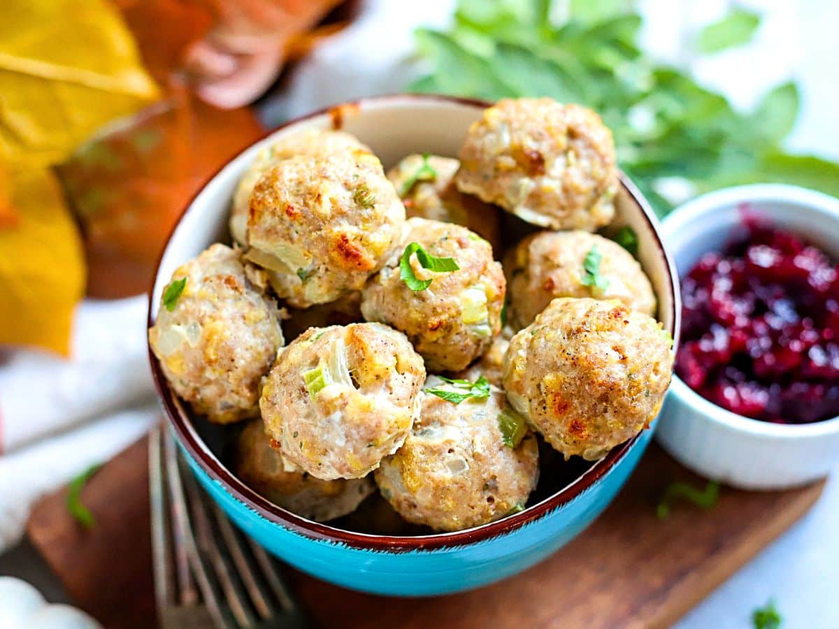 Bowl filled with turkey stuffing meatballs.