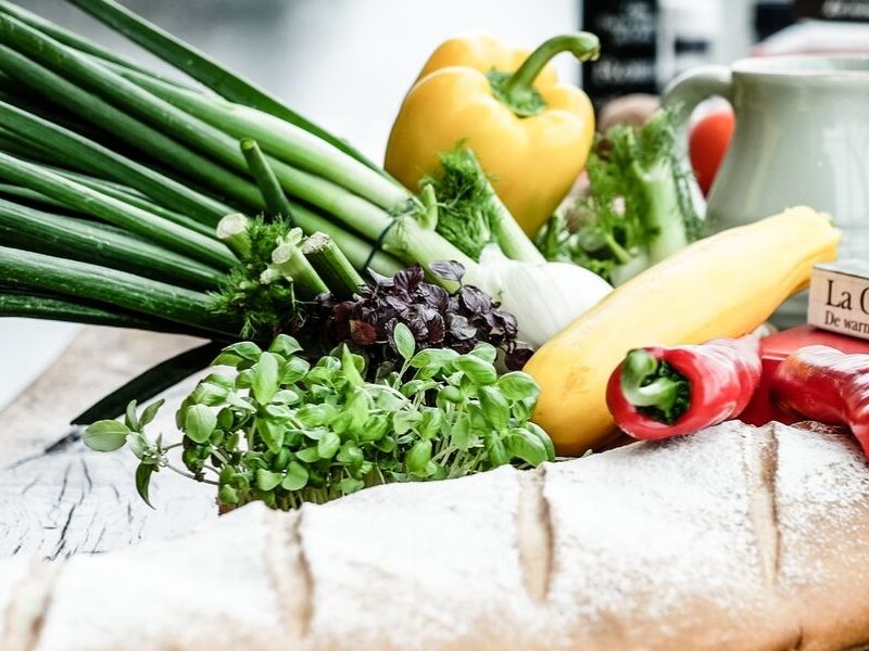 various vegetables sitting on a counter