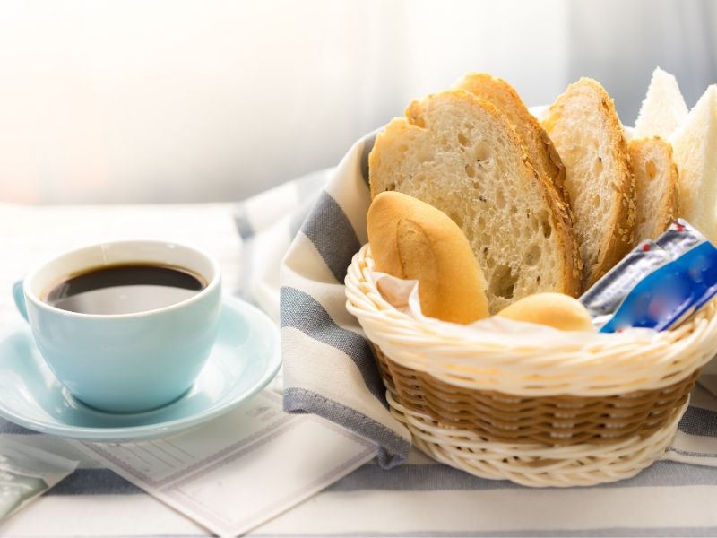 Bread in a basket with coffee