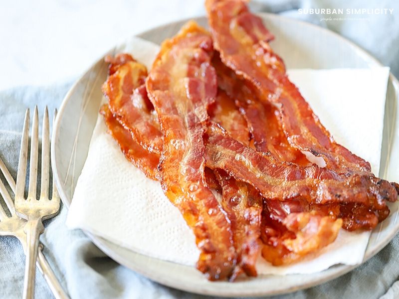 Cooked bacon on a plate.