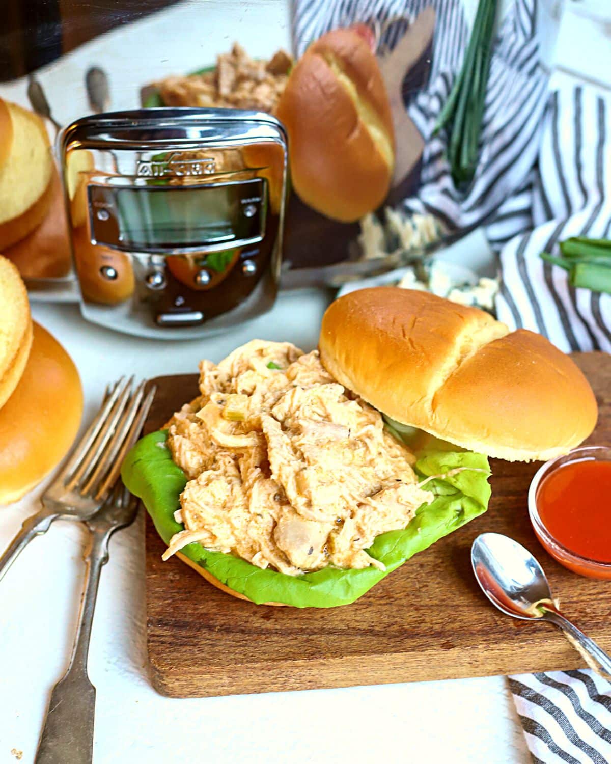 Buffalo chicken cooked in a slow cooker.