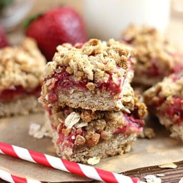 Two stacked strawberry oat bars.