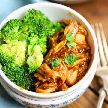 A Bowl full of honey garlic chicken with broccoli.