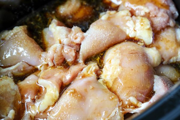 Honey Garlic Chicken coated in sauce in the crock pot