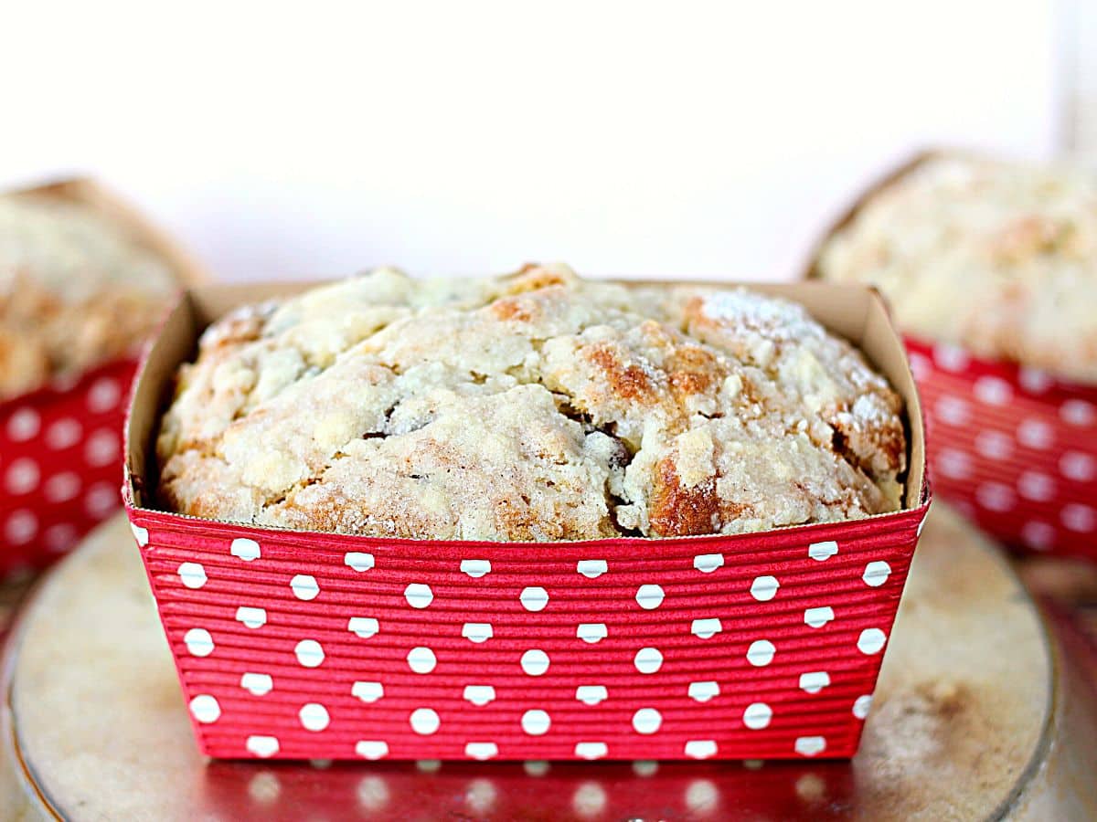 Small loaf pan with baked banana bread inside.