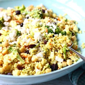 Couscous salad in a blue serving bowl.