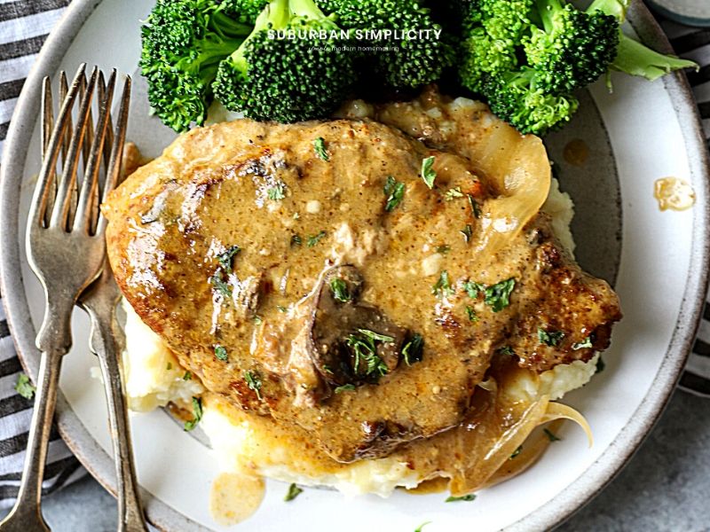 CrockPot Pork Chops on a plate with mashed potatoes