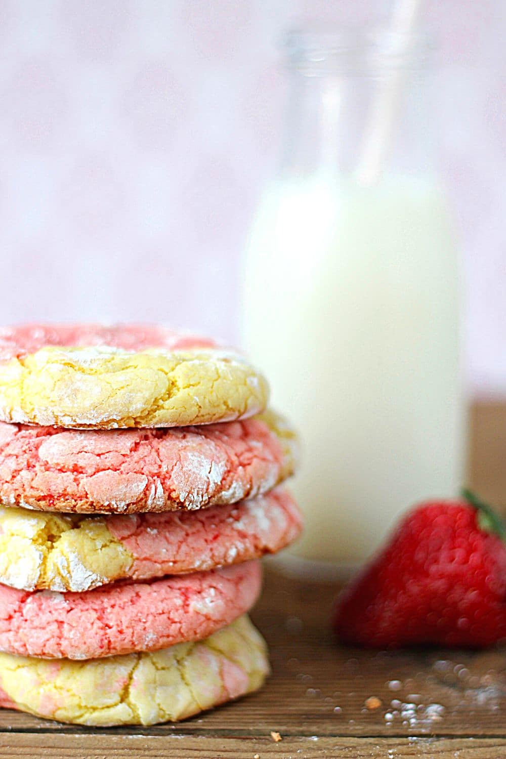 Stack of Strawberry Lemonade cookies with a jar of milk.