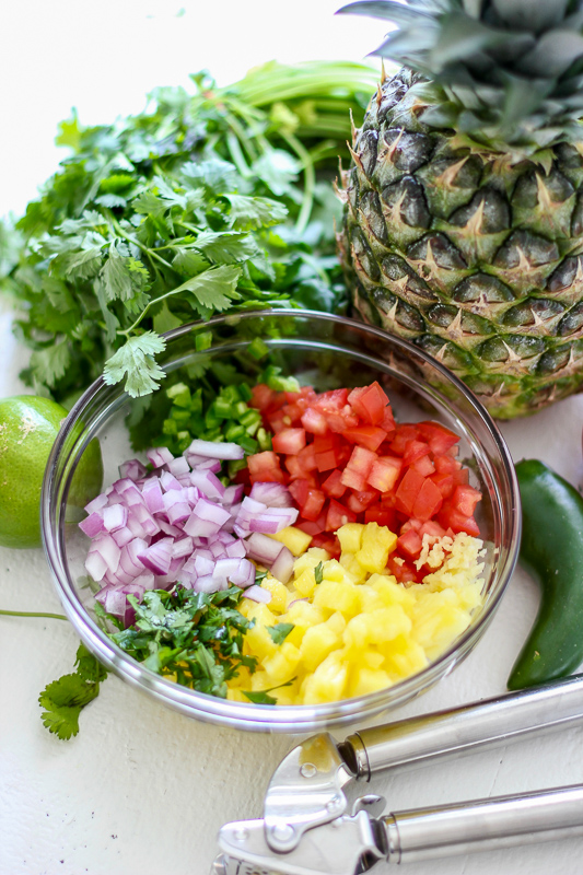 ingredients in a bowl for Pineapple Salsa.