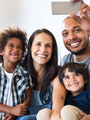 A family taking a selfie photo.