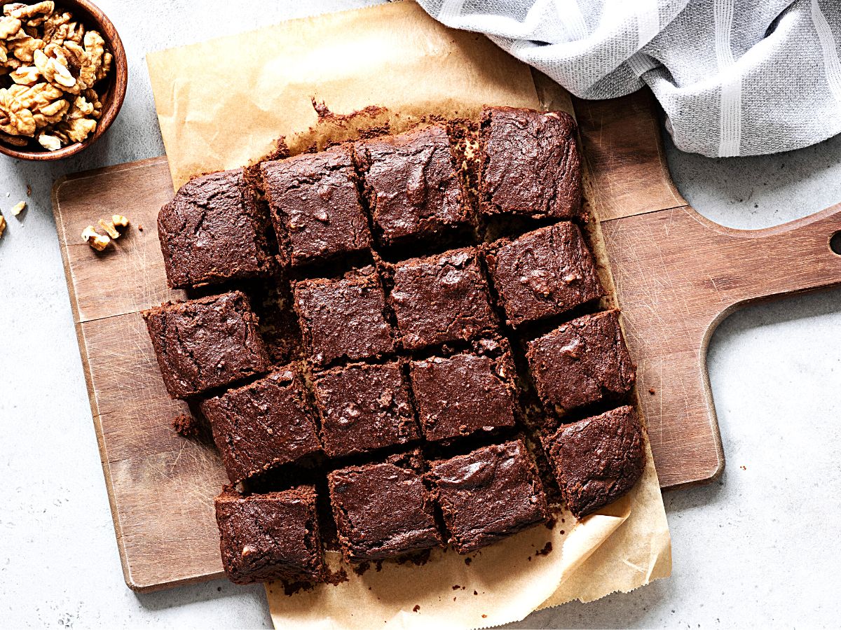 Dark chocolate brownies in a pan, cut into 16 squares.