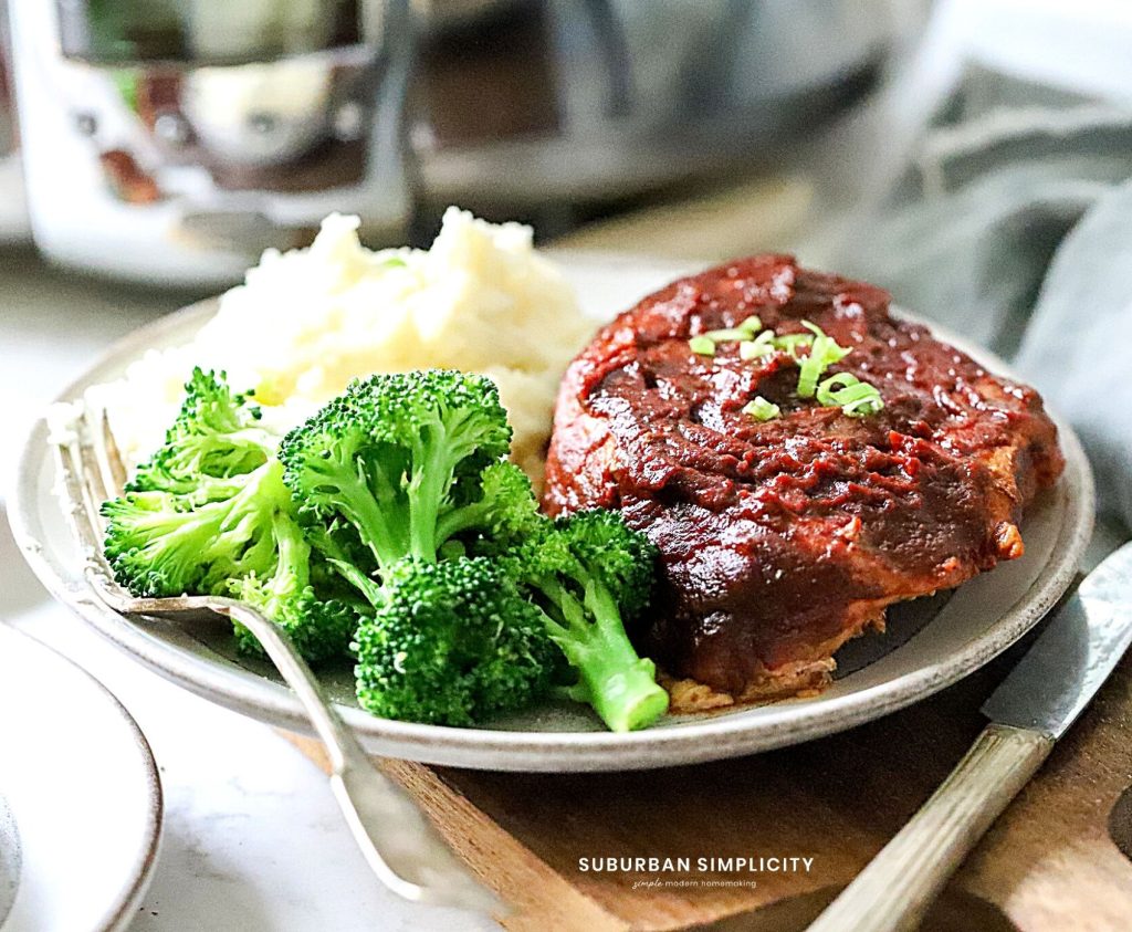 Slow Cooker BBQ Pork Chops on a plate with broccoli