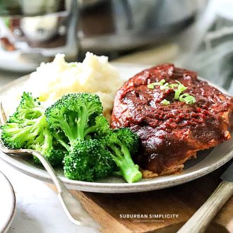 Slow Cooker BBQ Pork Chops on a plate with broccoli